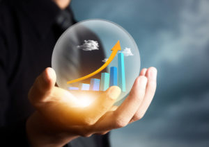 Person holding a crystal ball to illustrate a cash flow forecast.
