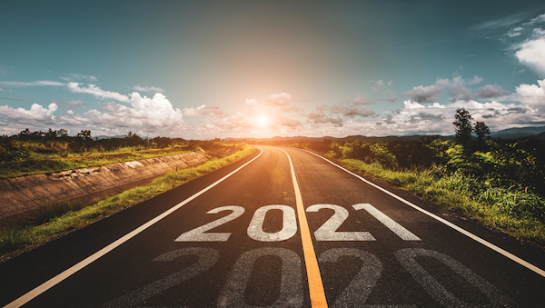 2021 printed on a highway to illustrate business trends 2021.