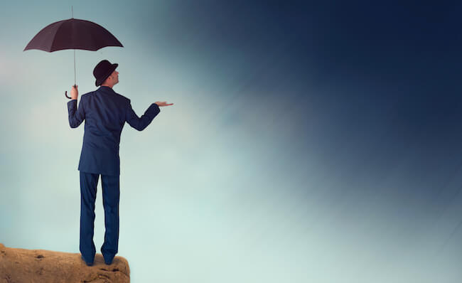 Person standing under an umbrella to illustrate "understanding forecasting."