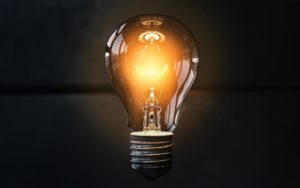 Light bulb to illustrate generating ideas for selling ancillary products or services as a way to increase cash flow.