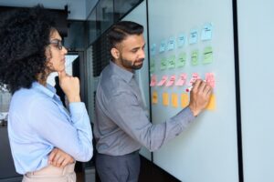 Workmates developing a plan to illustrate strategic human resource management.