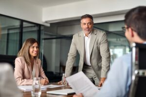 Business people discussing a strategy to increase valuation before selling a company.