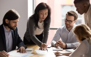 Executives discussing the results of a financial report to illustrate a blog post titled "What is Financial Reporting."