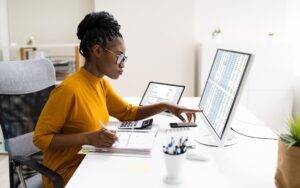 Businessperson checking the results of their work to illustrate accountability in the workplace.