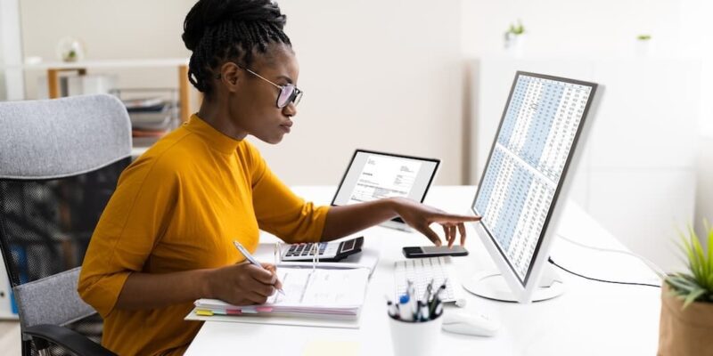 Businessperson checking the results of their work to illustrate accountability in the workplace.