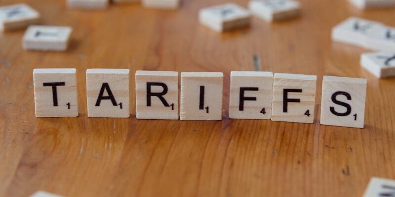 The word "tariffs" spelled out in scrabble tiles.