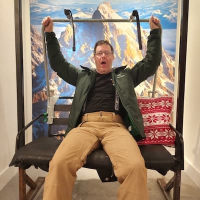 William Lieberman on a ski lift to illustrate a "baby William" page that explains what is is like to work with The CEO's Right Hand.