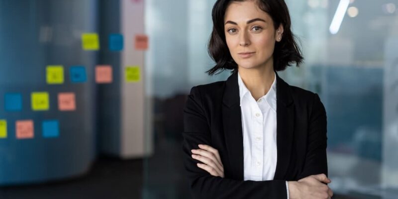 Confident business woman to illustrate a blog post about AI in finance and accounting and what CEOs must know.