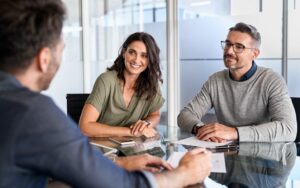 Business people in a meeting to illustrate founders engaged in a sales process.